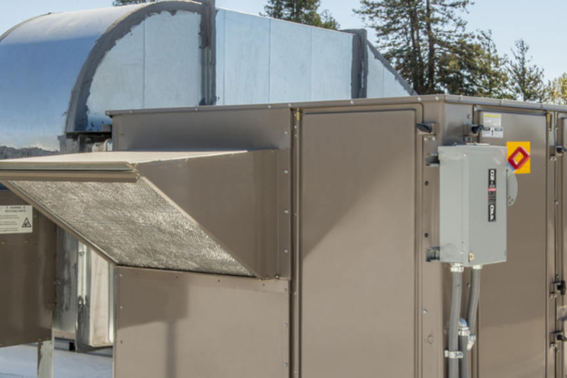 Commercial Heating Solutions. Photo of an HVAC /Heating unit installed on a rooftop.